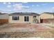 The backyard patio of a home with solar panels, perfect for outdoor entertaining and relaxation at 15614 E 51St Pl, Denver, CO 80239