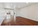 Bright living room featuring gleaming hardwood floors and neutral color palette at 15614 E 51St Pl, Denver, CO 80239