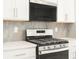 Stainless steel over-the-range microwave installed above the stove at 745 Tibet St, Aurora, CO 80018