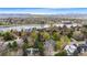 Aerial view of the property showcasing its location near a lake and mountainous terrain at 2500 Van Gordon St, Lakewood, CO 80215