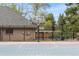 Image of a basketball hoop and partial court area surrounded by a fence and greenery at 2500 Van Gordon St, Lakewood, CO 80215