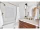 Charming bathroom features decorative tile accents, tub and shower combo, and modern vanity at 2500 Van Gordon St, Lakewood, CO 80215