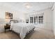 Comfortable bedroom with a large window, neutral carpet, and ample natural light at 2500 Van Gordon St, Lakewood, CO 80215