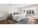 Cozy bedroom with a large window, comfortable bed, and neutral decor at 2500 Van Gordon St, Lakewood, CO 80215