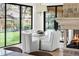 Elegant dining room featuring a modern glass table with views to the backyard at 2500 Van Gordon St, Lakewood, CO 80215