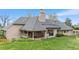 Exterior showcasing a covered patio and beautiful landscaping, enhancing outdoor living at 2500 Van Gordon St, Lakewood, CO 80215
