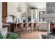 Beautiful kitchen featuring a large center island, custom cabinetry, and stone accents at 2500 Van Gordon St, Lakewood, CO 80215