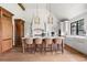 Spacious kitchen featuring a large center island with seating and custom cabinets at 2500 Van Gordon St, Lakewood, CO 80215