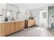 Bright main bathroom with double vanity, modern fixtures, and plenty of space, creating a spa-like retreat at 2500 Van Gordon St, Lakewood, CO 80215