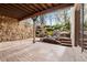 Stone patio featuring beautiful landscaping and a stone retaining wall at 2500 Van Gordon St, Lakewood, CO 80215
