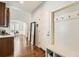 Welcoming entryway featuring hardwood floors, hall tree, and a decorative mirror, creating an inviting first impression at 5181 Delphinium Cir, Brighton, CO 80601
