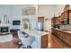 Open concept kitchen with stainless steel appliances, quartz countertops, and hardwood flooring at 5181 Delphinium Cir, Brighton, CO 80601