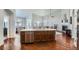 Open-concept kitchen with a center island, stainless steel appliances, and seamless flow to the living spaces at 5181 Delphinium Cir, Brighton, CO 80601