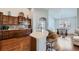 Well-appointed kitchen featuring a breakfast bar, modern appliances, and stylish backsplash at 5181 Delphinium Cir, Brighton, CO 80601