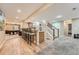 An open finished basement featuring a wet bar with barstool seating, a pool table, and a staircase at 6302 S Jackson Gap Ct, Aurora, CO 80016