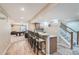 Finished basement featuring a bar area and a game room, perfect for entertaining friends and Gathering at 6302 S Jackson Gap Ct, Aurora, CO 80016