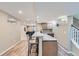 Basement bar with seating, granite countertops, and wood-look tile flooring, perfect for entertaining at 6302 S Jackson Gap Ct, Aurora, CO 80016
