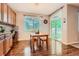 Eat-in kitchen featuring wood cabinets, hardwood floors and plenty of natural light at 6302 S Jackson Gap Ct, Aurora, CO 80016