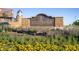 The Southlands community sign with flowerbeds creates a welcoming entrance at 6302 S Jackson Gap Ct, Aurora, CO 80016