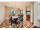 Formal dining room featuring hardwood floors and space for a table with six chairs at 6302 S Jackson Gap Ct, Aurora, CO 80016