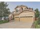 Inviting two-story home with a two-car garage and a beautifully landscaped front yard at 6302 S Jackson Gap Ct, Aurora, CO 80016