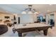 Finished basement with a pool table, comfortable seating, and an entertainment area at 6302 S Jackson Gap Ct, Aurora, CO 80016