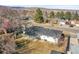 Aerial view of the property, showcasing backyard and covered patio in quiet neighborhood at 10930 W Tulane Ave, Littleton, CO 80127