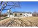 Spacious backyard featuring a covered patio, ideal for outdoor gatherings and relaxation at 10930 W Tulane Ave, Littleton, CO 80127