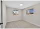 Bedroom featuring neutral paint, carpet, and dual windows at 10930 W Tulane Ave, Littleton, CO 80127