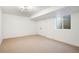 Unfurnished basement area with a window, a drop ceiling, and double door closet at 4227 Mariposa St, Denver, CO 80211