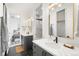 Well-appointed bathroom with dual vanities, modern fixtures, and a walk-in shower offers spa-like comfort at 4227 Mariposa St, Denver, CO 80211