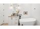 Elegant bathroom featuring a freestanding tub, vanity with sleek fixtures, and stylish decor, a spa-like retreat at 4227 Mariposa St, Denver, CO 80211