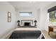 Comfortable bedroom features modern lighting, windows with views, and stylish furnishings for relaxation at 4227 Mariposa St, Denver, CO 80211