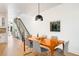 Dining room featuring a wooden table with seating and modern decor, located near an open staircase at 4227 Mariposa St, Denver, CO 80211