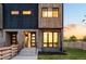Modern two-story home with brick and wood accents, large windows and private yard at 4227 Mariposa St, Denver, CO 80211