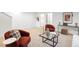 Cozy living area featuring comfortable seating, stylish decor, and a contemporary glass-top coffee table at 4227 Mariposa St, Denver, CO 80211