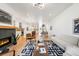 Spacious living room with fireplace and view of kitchen and dining area at 4227 Mariposa St, Denver, CO 80211