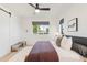 Bright bedroom featuring a ceiling fan, modern décor, and large windows at 4227 Mariposa St, Denver, CO 80211