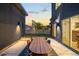 Outdoor patio with a dining table, perfect for entertaining, set against the home's modern architecture at 4227 Mariposa St, Denver, CO 80211
