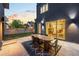 Outdoor patio with dining table, connecting seamlessly to the interior via sliding glass doors at 4227 Mariposa St, Denver, CO 80211