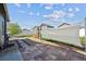 Landscaped backyard featuring a stone patio, privacy fencing, and well-maintained lawn at 2431 Nicholson St, Berthoud, CO 80513