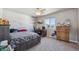 Spacious bedroom featuring a desk, closet, neutral paint and carpet, and plenty of natural light at 2431 Nicholson St, Berthoud, CO 80513