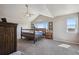 Main bedroom with natural light, high ceilings, and plenty of space for furniture and decor at 2431 Nicholson St, Berthoud, CO 80513