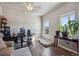 Bright bedroom with hardwood floors, natural light, ceiling fan, and flexible space offers comfort and functionality at 2431 Nicholson St, Berthoud, CO 80513