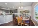 Charming dining area with hardwood floors and natural light, creating a warm and inviting space at 2431 Nicholson St, Berthoud, CO 80513