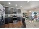 Modern kitchen featuring granite countertops, stainless steel appliances, and ample storage, perfect for culinary enthusiasts at 2431 Nicholson St, Berthoud, CO 80513