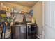 Laundry room equipped with modern washer and dryer, shelving, and ample storage space at 2431 Nicholson St, Berthoud, CO 80513