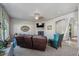 Inviting living room with stone fireplace and comfortable seating, seamlessly blending style and relaxation at 2431 Nicholson St, Berthoud, CO 80513