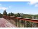 Lovely balcony with wood decking offering picturesque mountain views at 11724 Little Turtle Ln, Conifer, CO 80433
