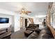 Basement living room with wood-burning stove and ample seating at 11724 Little Turtle Ln, Conifer, CO 80433